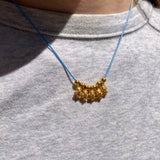 Kinira-Mymosaa_bijoux_de_Mediterranee_collier_argent_cisele_or_sur_cordon_bleu