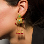 Tymfi-Boucles_d_oreille_en_argent_en_or_24K_cisele_et_agrementees_de_perles_corail__turquoise_portees